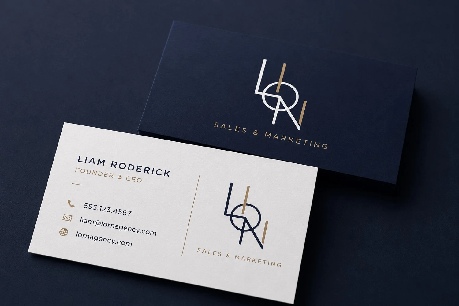 Business card concept showing the LION monogram across navy and white stationery