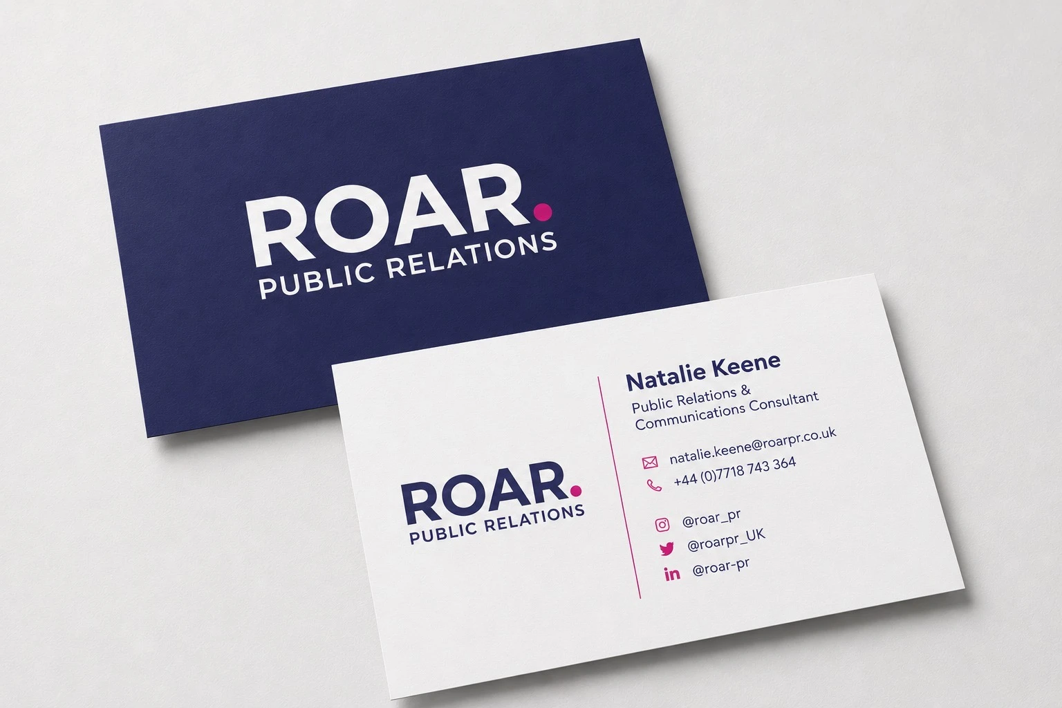 Business card concept showing the ROAR wordmark across navy and white stationery